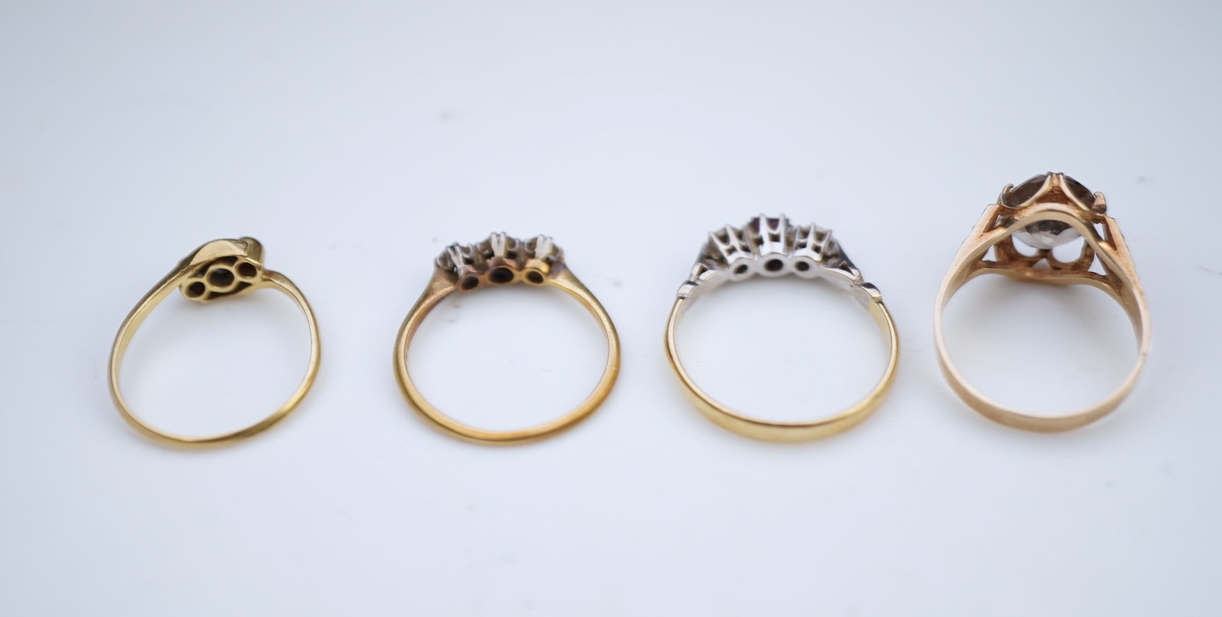 Four gem-set rings